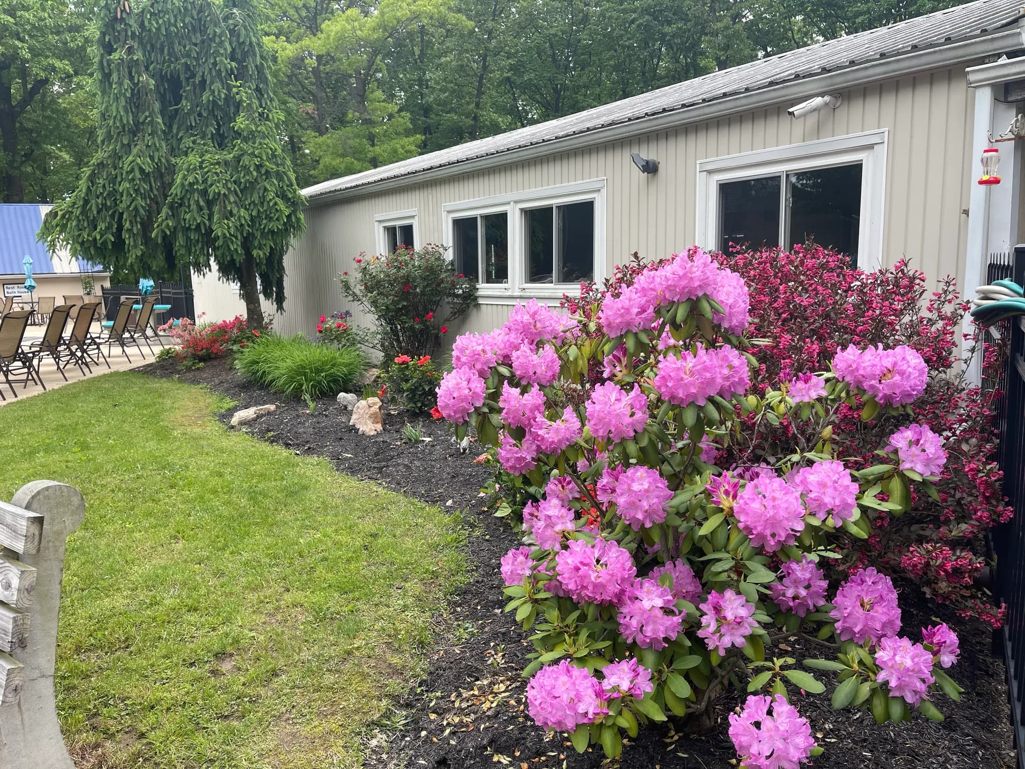 Landscaped gardens and clubhouse beside the pool area